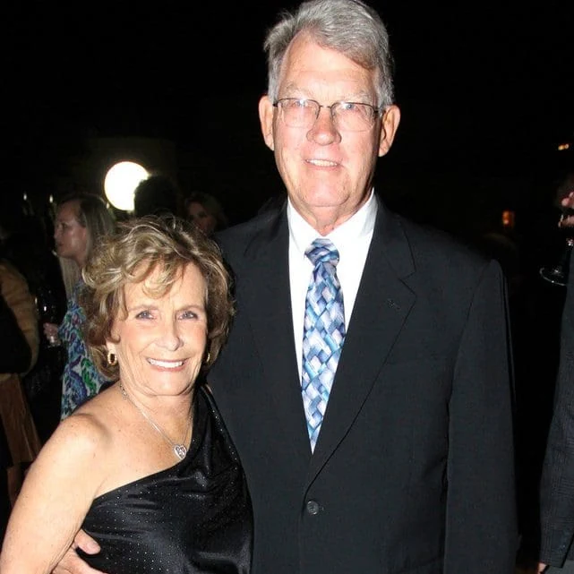 Two guests dressed for an evening celebration.
